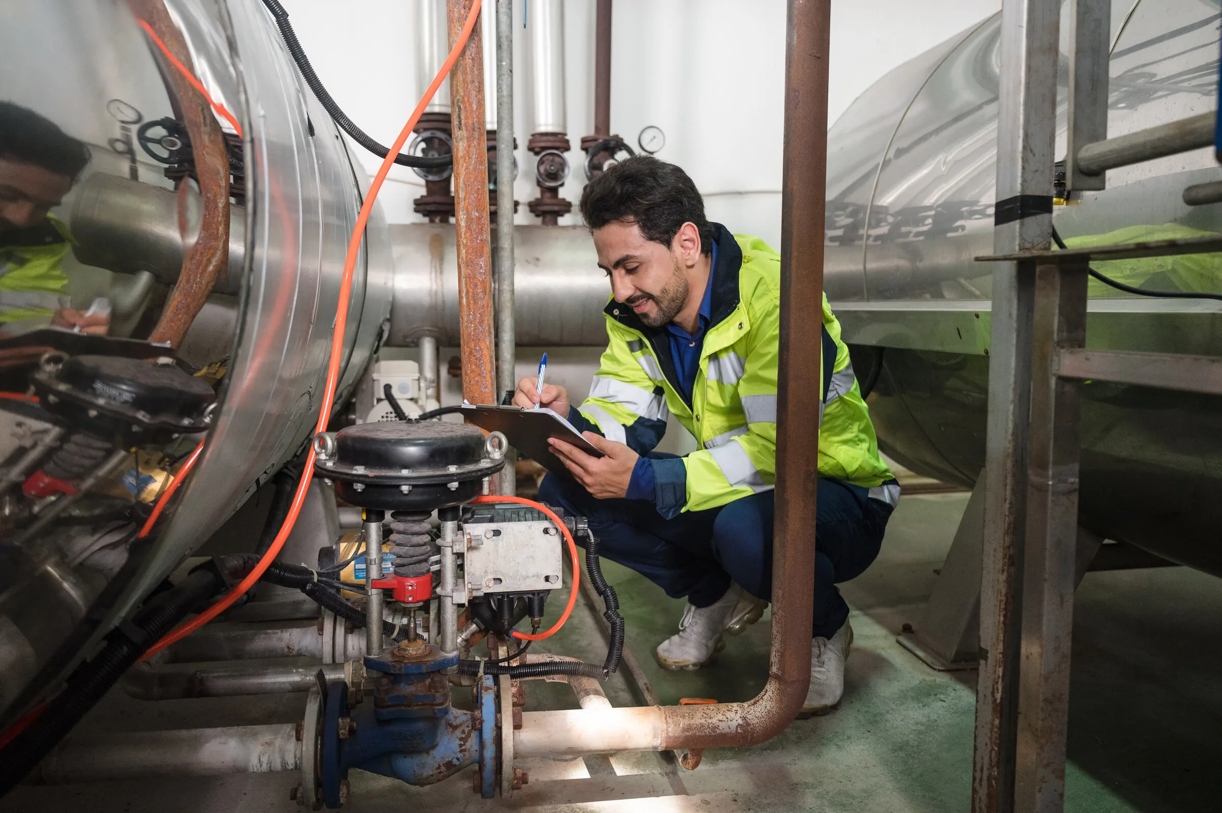 Engineer inspecting industrial equipment